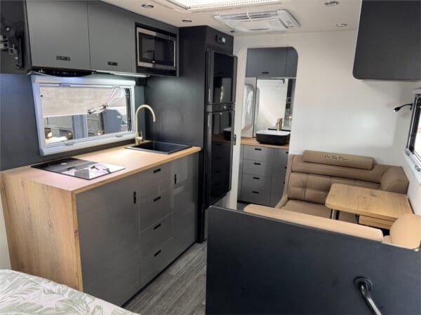  Raptor coated<br />Tuffride 3.0T coil & twin shock suspension<br />16" tyres & rims<br />D035 hitch<br />Single manual pull-out step<br />Drop-down stabilising legs<br />Toolbox and battery boxes on chassis rail<br />Spacious and Comfortable:<br />Full ensuite with frosted glass shower door<br />Laminate benchtops<br />Pillow-top innerspring mattress<br />Modern lightweight furniture<br />Full upholstered bed head<br />Fabric or bonded leather lounge<br />Unrivalled Storage:<br />Three external tunnel boots<br />Overhead cupboards throughout<br />Magazine pouch and embroidered head bumper<br />Stay Connected:<br />400 watts of solar power<br />200amp lithium batterY<br />3000W inverter<br />MPPT 30amp solar controller & LCD monitoring display<br />Modern Conveniences:<br />Compressor fridge with external fridge vents<br />Reverse cycle air conditioner<br />Washing machine<br />Full Induction Cook Top<br />Rangehood and flush-mounted microwave<br />Safety and Security:<br />Electronic stability control<br />Double-glazed windows<br />Triple lock security door<br />Dust pressure hatch<br />Composite smooth finish with one-piece fibreglass roof<br />Plumbing:<br />Fresh water tanks 95 litres x 2<br />Grey water tank 95 litres<br />Gas bottle 9kg x 2<br />External shower and BBQ bayonet<br />Gas/electric hot water system<br />Why Choose On The Move Traxx 17’ Centre Door?<br /><br />Quality Craftsmanship: Known for its attention to detail and high-quality materials