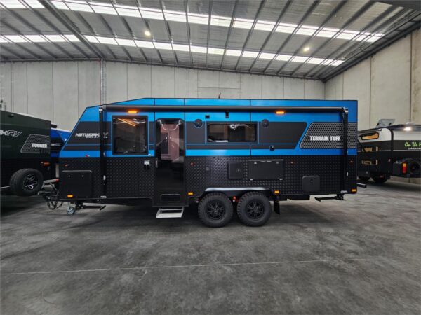  this caravan delivers comfort and confidence every step of the way.<br />Why Choose the Network RV Off-Roader?<br /><br />Independent Suspension – Engineered for stability and smooth towing across rough terrain.<br />Family-Friendly Design – Wide bunks for the kids and a spacious queen-size bed up front for ultimate comfort.<br />Premium Interior Finish – Chrome blue walls paired with warm wood-grain floors and cabinetry create a stylish